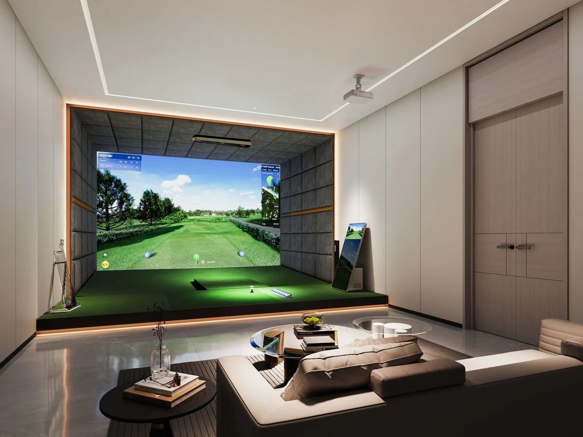 Comfortable private indoor golf bay with lounge-style seating